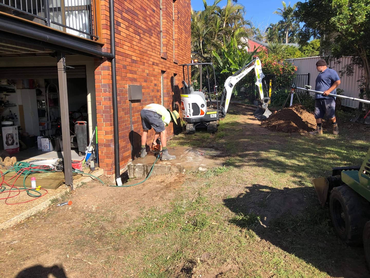 Retaining, turfing, fencing, concreting and new side entrance