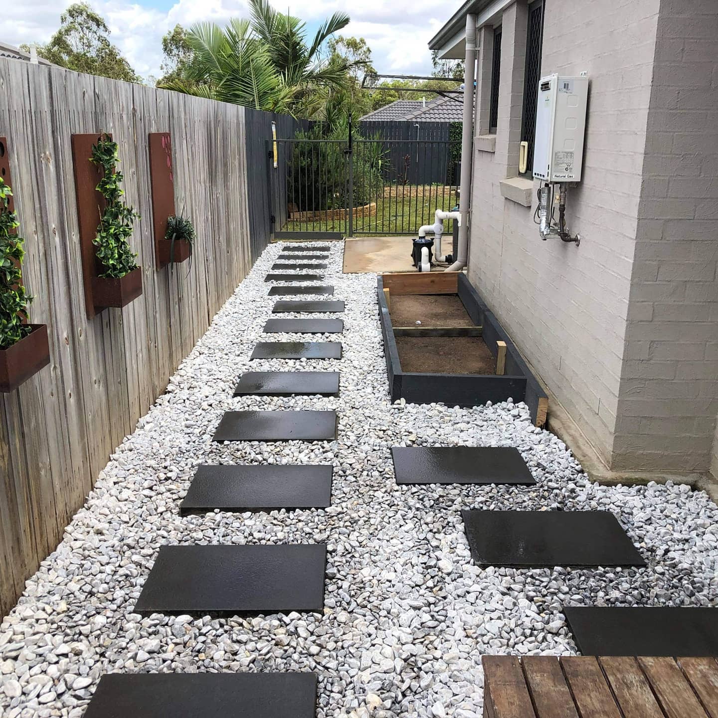 Stepping stone paving creates a beautiful and inviting pathway through your backyard.